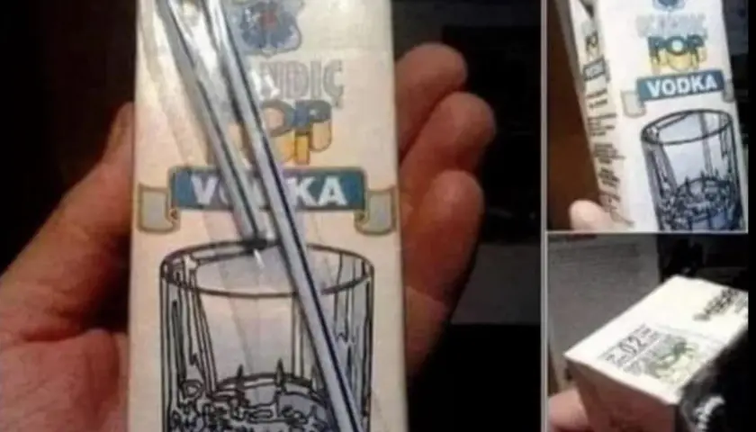Opakowanie wódki z grafiką szklanki i słomki. Pytanie: skutki picia wódki przez słomkę, dlaczego upijamy się szybciej.
