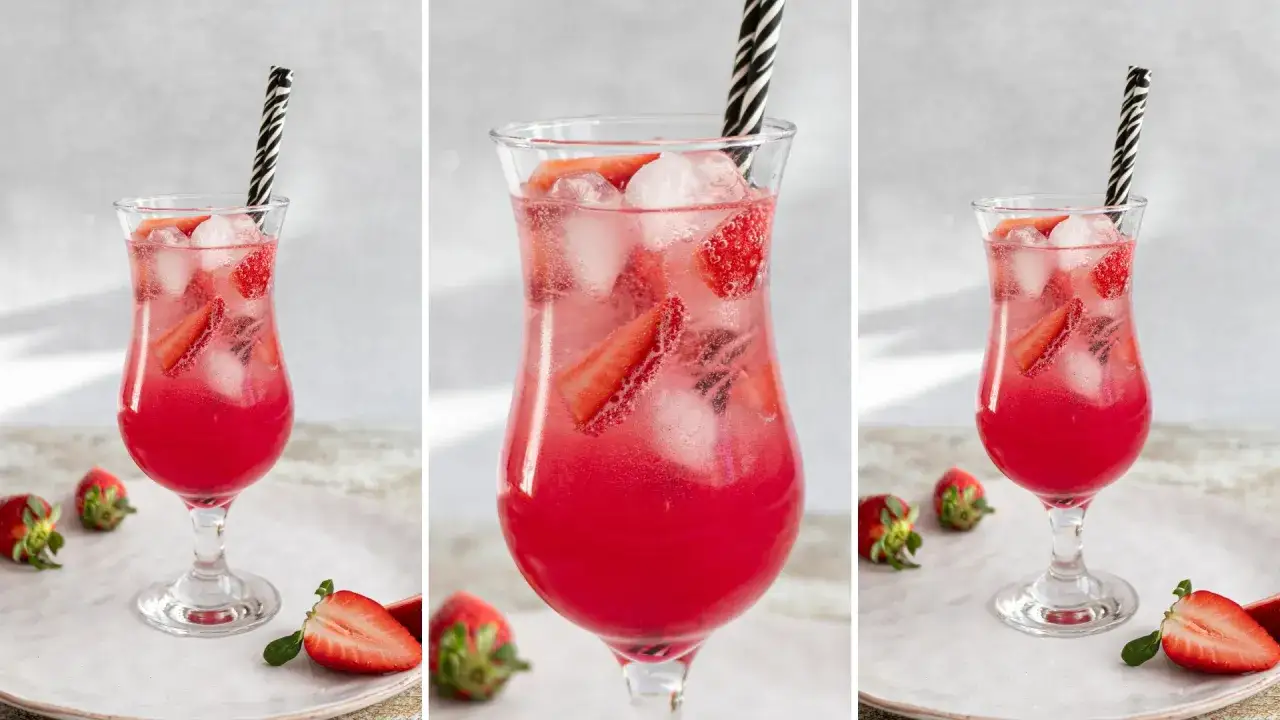 Orzeźwiający, różowy drink z truskawkami i lodem, z czarno-białą słomką. Czy wódka jest gazowana? To pytanie pozostaje bez odpowiedzi, ale drink wygląda kusząco.